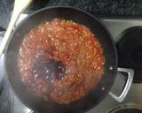 A picture of step 3 of Pork and beef meatballs in a slow braised tomato sauce and pasta.