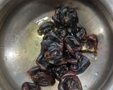 A picture of step 1 of Stuffed Dates in ganache.