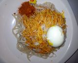 A picture of step 2 of Taliyar Hausa with palm oil,pepper and boiled egg#kaduna state.