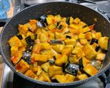 A picture of step 14 of Eggplant Curry with Mushrooms, Tomatoes, and Coconut Milk.