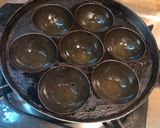 A picture of step 6 of Unniyappam~traditional Kerala snack.