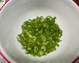 A picture of step 3 of Pork Chops with Zesty Green Onion Salsa.