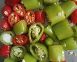 A picture of step 1 of 2minutes green &red chilli pickle.