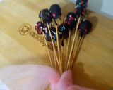 A picture of step 7 of 1 bite chocolatey marshmallow pops.