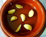 Foto del paso 9 de la receta: Cigalitas y ajos macerados en aceite de oliva confitados