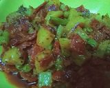 A picture of step 12 of ALU gajar matar meithe,.