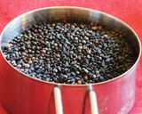 A picture of step 2 of Ellu satham (ellorai in Tamil)-Rice cooked with sesame seed masala powder.