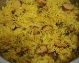 A picture of step 5 of Tumeric rice with sausages, egg curry and salad.