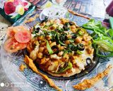 A picture of step 16 of Desi style Chhole Achhari piza.