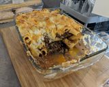A picture of step 12 of Greek lamb pastitsio bake with rocket salad.