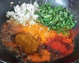 A picture of step 3 of Coconut chicken with fresh methi leaves.
