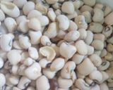 A picture of step 1 of Rice and beans with moringa leaves.