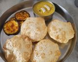 A picture of step 12 of Luchi and Cholar Dal.