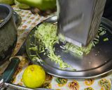 A picture of step 1 of Rice is Nice Mango and Amla Rice with side dish vegetable Avial.
