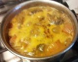 A picture of step 5 of Drum stick tomato masala curry (sambar) mixed with rice.