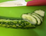 A picture of step 2 of Enoki mushrooms and cucumber with umeboshi flavored ponzu dressing.