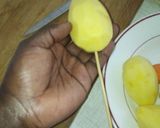 A picture of step 3 of Spiral potato and carrots on stick.