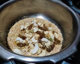 A picture of step 2 of Doodh daliya in pressure cooker (with different toppings).