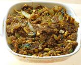 A picture of step 4 of Spicy aromatic nutritious stuffed bitter gourd in tomato sauce.