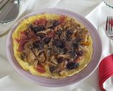 Foto del paso 3 de la receta Tortilla abierta con setas y pasas