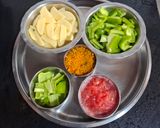 A picture of step 1 of Capsicum Sabzi.