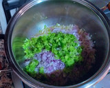 Foto del paso 6 de la receta: Calamares en su tinta con un toque de pasta de curry verde
