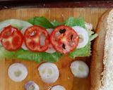A picture of step 3 of Homemade Chicken Salami sandwich in Subway style.