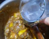 A picture of step 6 of Alu gosht.
