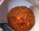 A picture of step 3 of Fried yam coated with egg and spicy fry sauce.