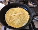 A picture of step 3 of Omelette with instant noodle and cheese inside 😎.