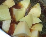 A picture of step 4 of Green coriander & potato curry.