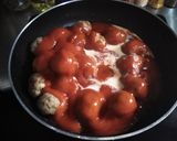 A picture of step 8 of Grandma's Meatballs - with Tomato Oregano Sauce.