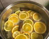 A picture of step 2 of Christmas cookies dipped in honey, aka melomakarona.