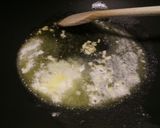 A picture of step 2 of Sauteed mushrooms and wilted spinach in garlic butter.