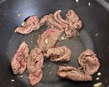 A picture of step 4 of Beef in gravy sauce over rice.