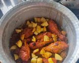 A picture of step 6 of Smokey tandoori chicken drumsticks biryani with mint mango raita.