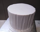 A picture of step 6 of 8 inch tall chocolate brownie cake.