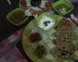 A picture of step 14 of Muli ka paratha with salad, curd, tomatoe chutney & dhaniya chutney.