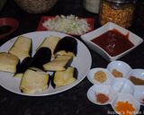 A picture of step 16 of Eggplatns onions with tomato sauce.