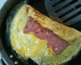 Foto del paso 5 de la receta: Rollitos de tortilla de huevos y jamón