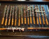 A picture of step 5 of Christmas chocolate covered pretzel rods.