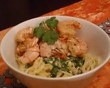 A picture of step 5 of Sautéed prawns on a bed of creamy spaghetti .