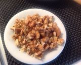 A picture of step 5 of Spaghetti with Rabbit Ragù, Mushrooms, and Walnuts.