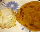 A picture of step 1 of Paratha (fry egg).