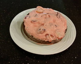 A picture of step 22 of Chocolate Layer Cake with Strawberry Cream Filling, White Chocolate Ganache Frosting coated with a Chocolate Crumble.