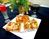 A picture of step 7 of Chicken tikka pizza.