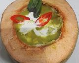 A picture of step 5 of Green Curry Chicken in Young Coconut.