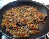 A picture of step 5 of Spaghetti with Rabbit Ragù, Mushrooms, and Walnuts.