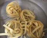 A picture of step 4 of Chicken Alfredo Pasta.