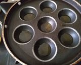 A picture of step 3 of Sabudana vada in appe pan.